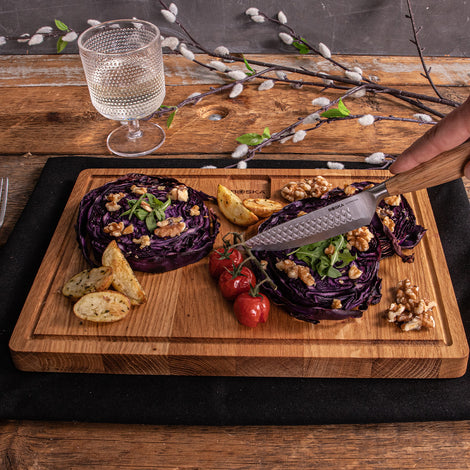 Oven-roasted red cabbage steak with walnuts and arugula